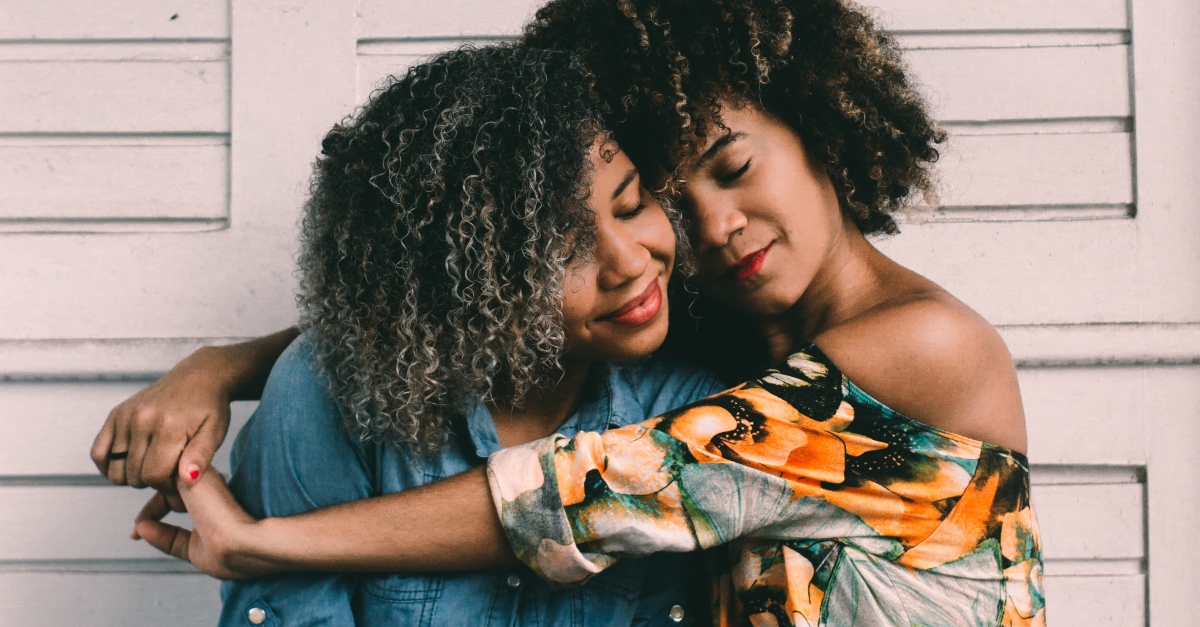 two young women hugging