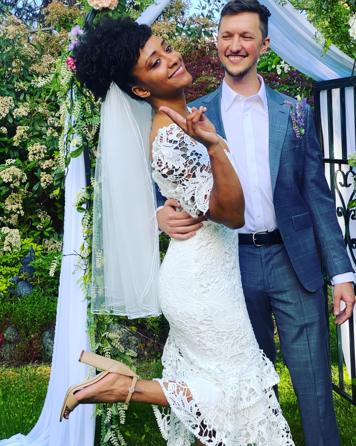 Colin and Carlene, a successful OkCupid couple from the Bay Area, smiling together during a sunny summer outing.